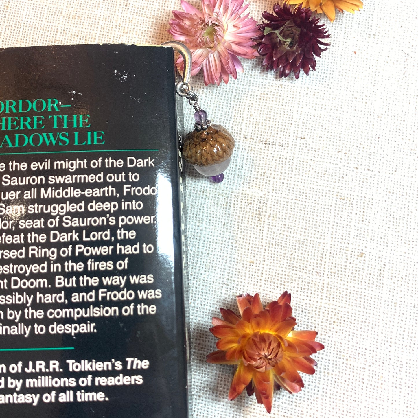 a book on a table with flowers on it