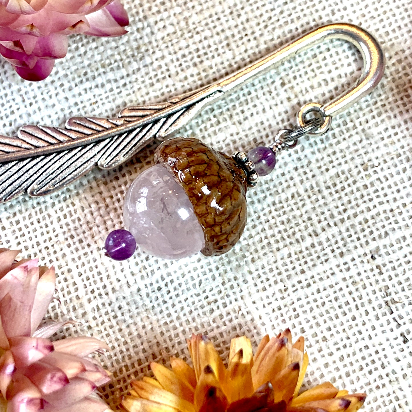 a pair of earrings sitting on top of a table