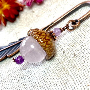 a close up of a pair of earrings on a table