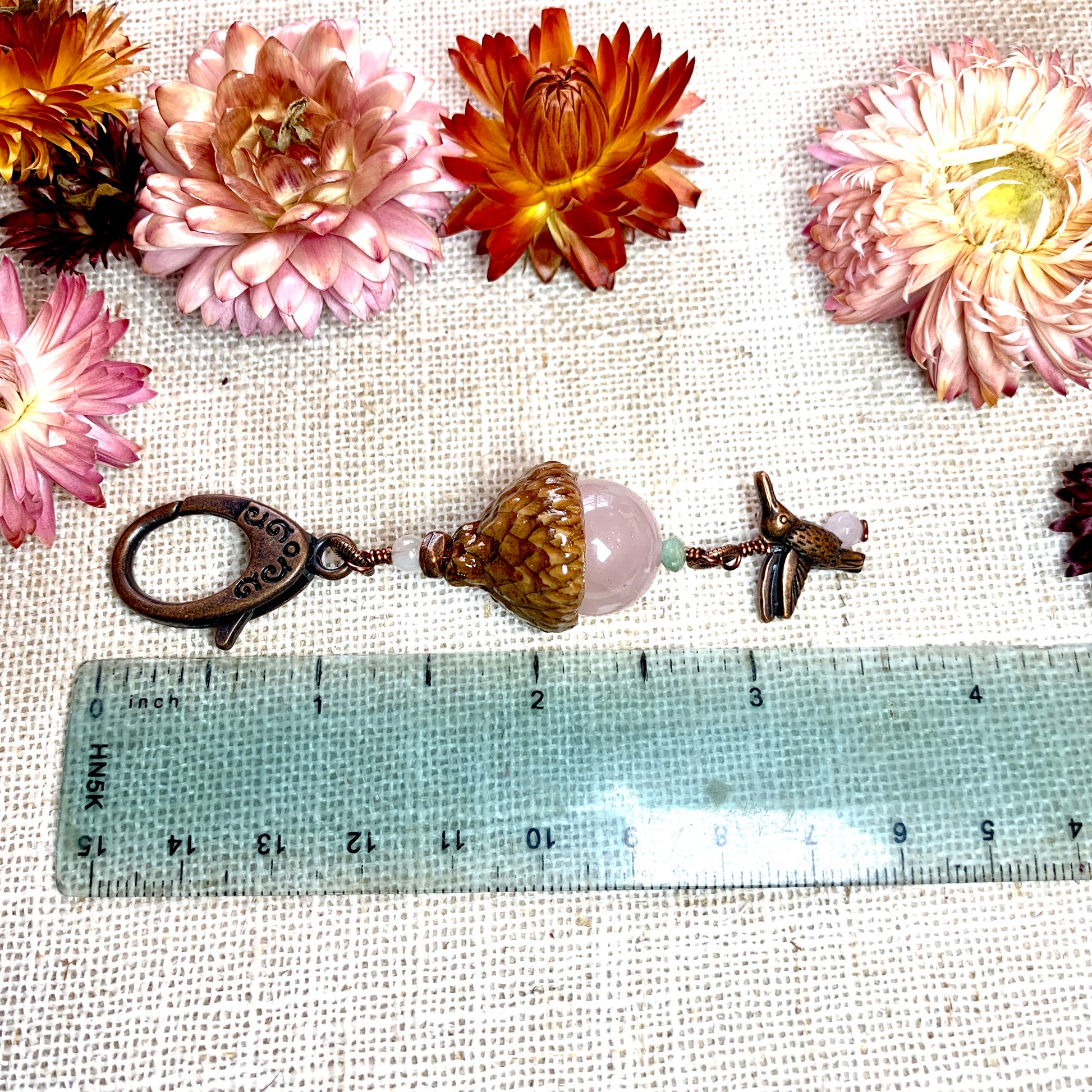 a ruler with flowers and a pair of scissors
