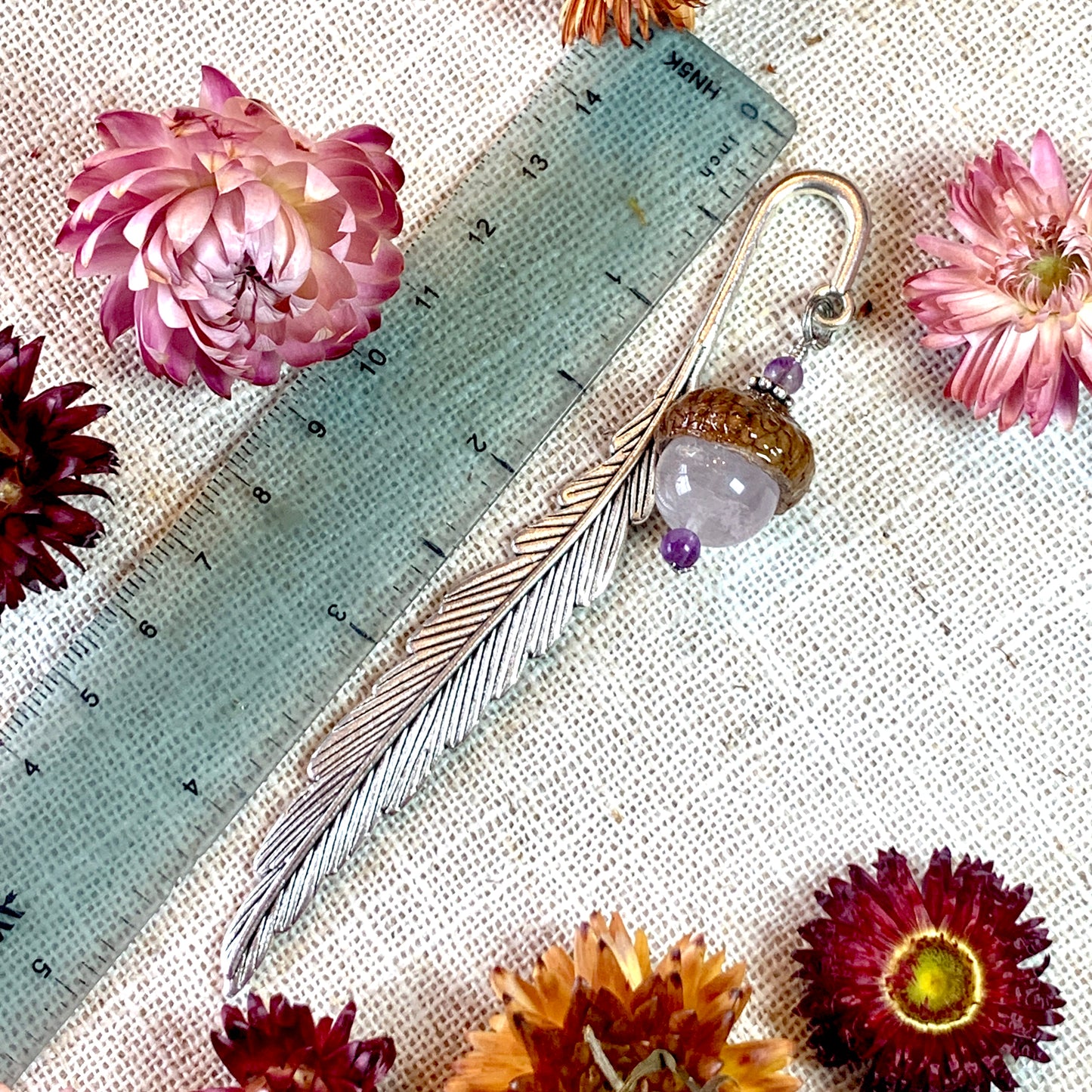 a close up of flowers on a table with a ruler
