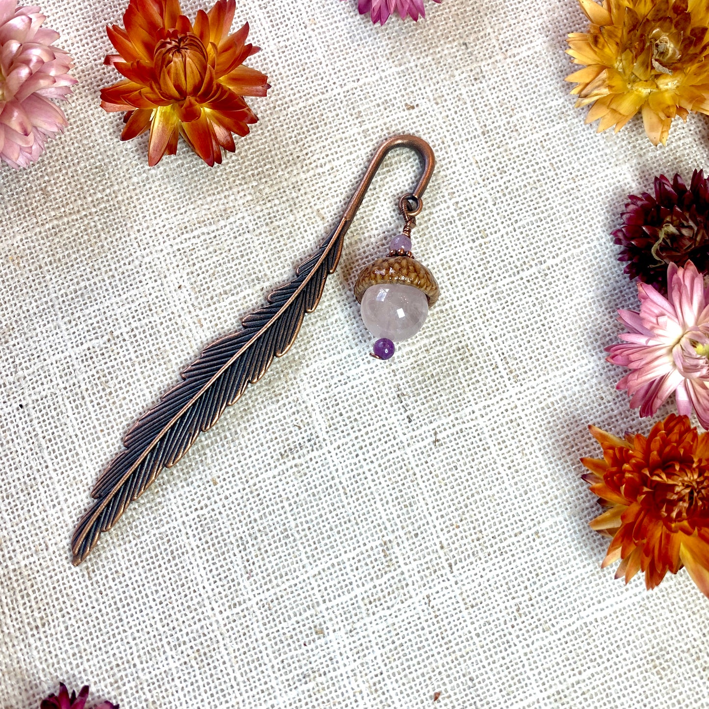 a close up of a pair of scissors near flowers